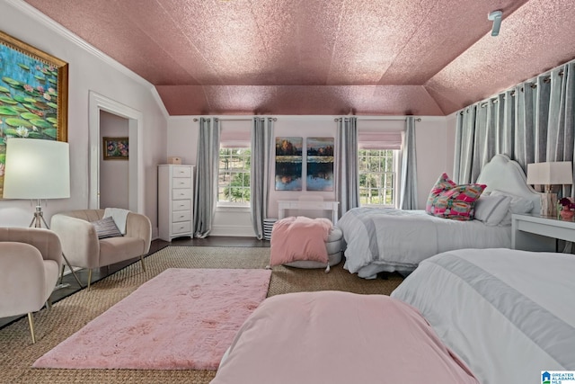 bedroom with ornamental molding, multiple windows, and vaulted ceiling