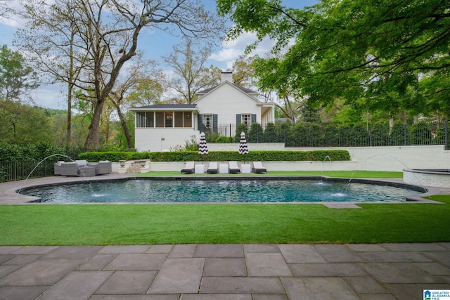view of swimming pool with a lawn, an outdoor living space, a fenced in pool, and fence