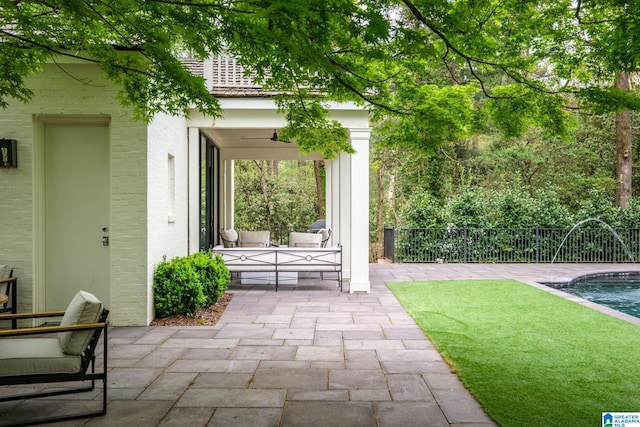 view of patio / terrace featuring fence and a fenced in pool