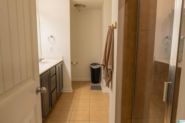 full bath featuring vanity, a shower stall, and tile patterned floors