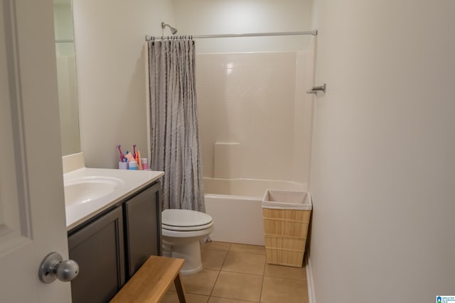 bathroom featuring toilet, vanity, shower / tub combo with curtain, and tile patterned floors