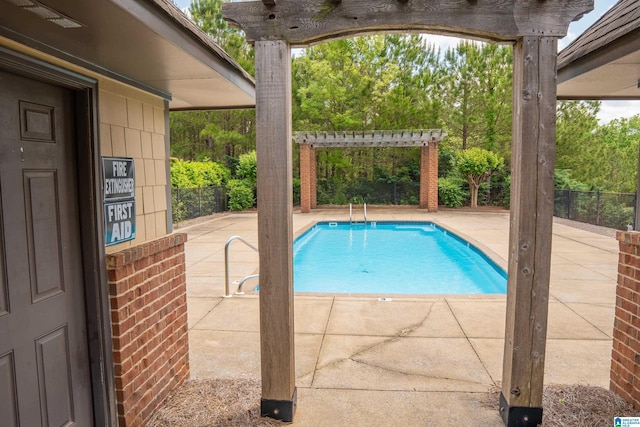 view of swimming pool with a patio, a fenced in pool, a pergola, and fence