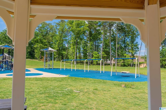 community jungle gym with a yard