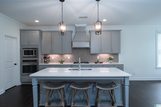kitchen featuring custom range hood, appliances with stainless steel finishes, visible vents, gray cabinetry, and light countertops
