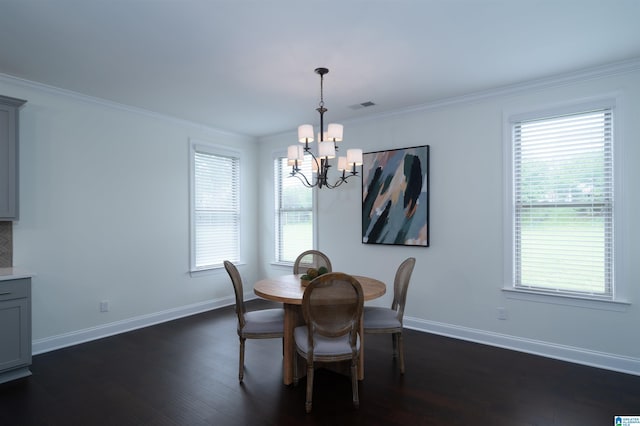 dining area with a notable chandelier, baseboards, a healthy amount of sunlight, and visible vents