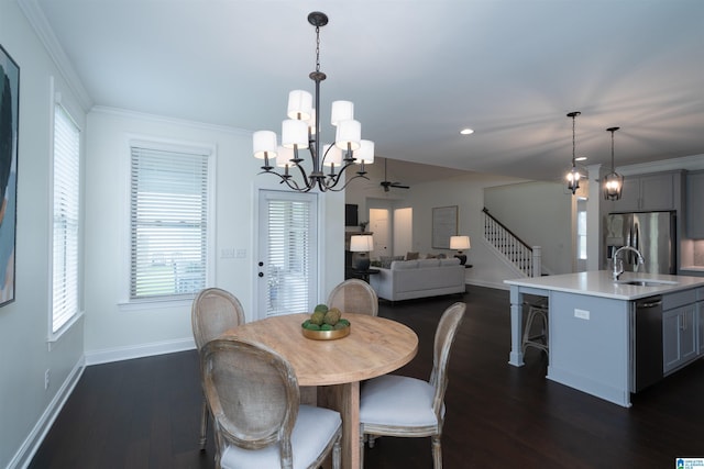 dining room featuring dark wood finished floors, a notable chandelier, and baseboards