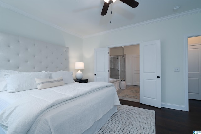 bedroom featuring dark wood finished floors, ceiling fan, baseboards, ornamental molding, and ensuite bathroom
