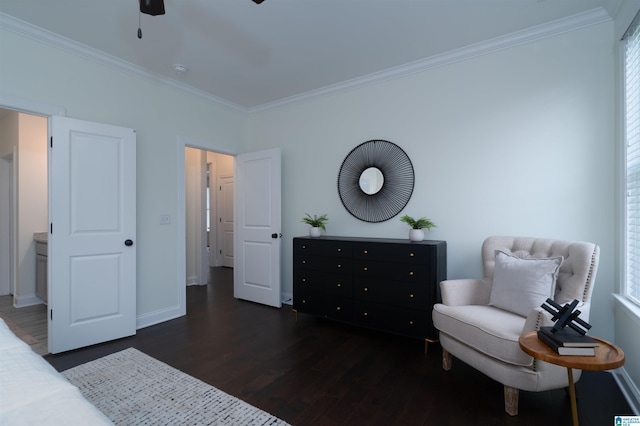 bedroom with baseboards, wood finished floors, and ornamental molding