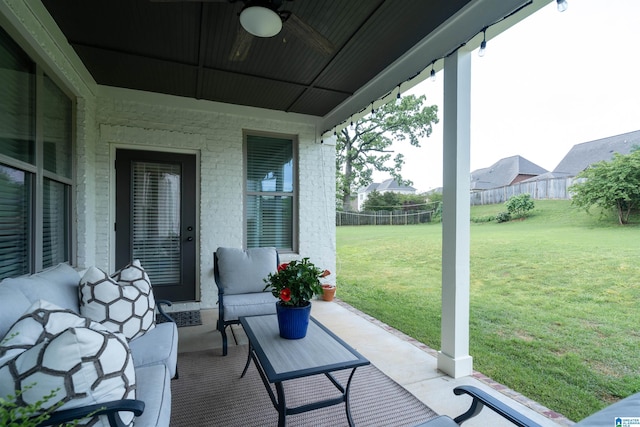 view of patio / terrace featuring fence and ceiling fan