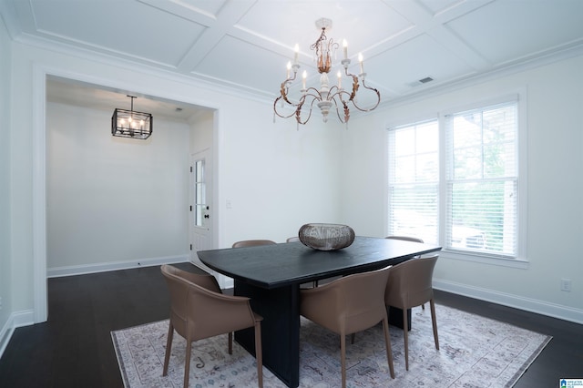 dining space featuring coffered ceiling, a notable chandelier, and a wealth of natural light