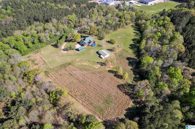 birds eye view of property with a rural view and a view of trees