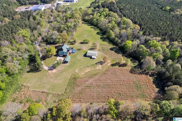 drone / aerial view with a rural view and a wooded view
