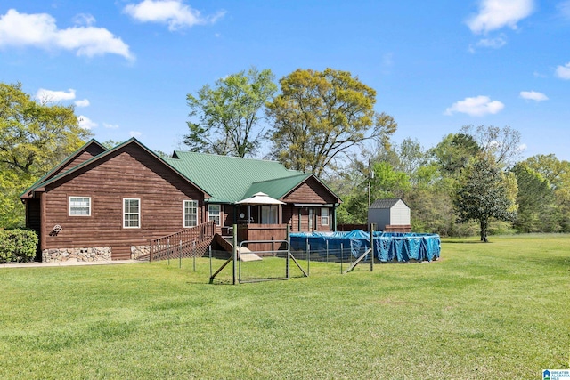 back of house with a lawn