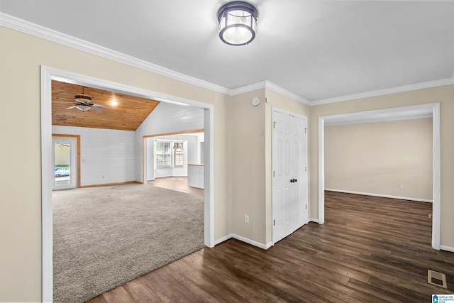 interior space with baseboards, wood finished floors, visible vents, and vaulted ceiling
