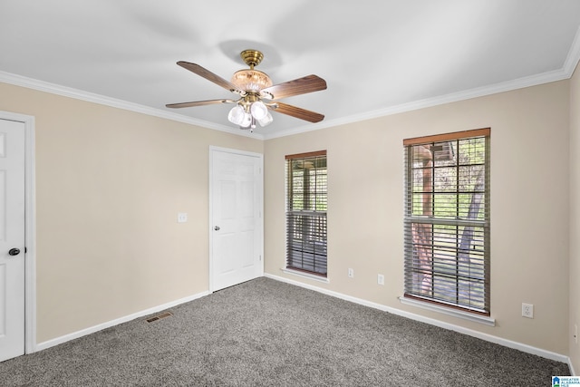 interior space with ceiling fan, carpet floors, and ornamental molding