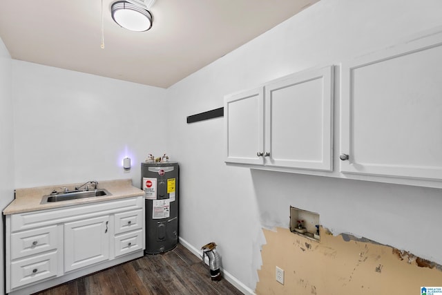 laundry room with a sink, hookup for a washing machine, water heater, cabinet space, and dark wood-type flooring