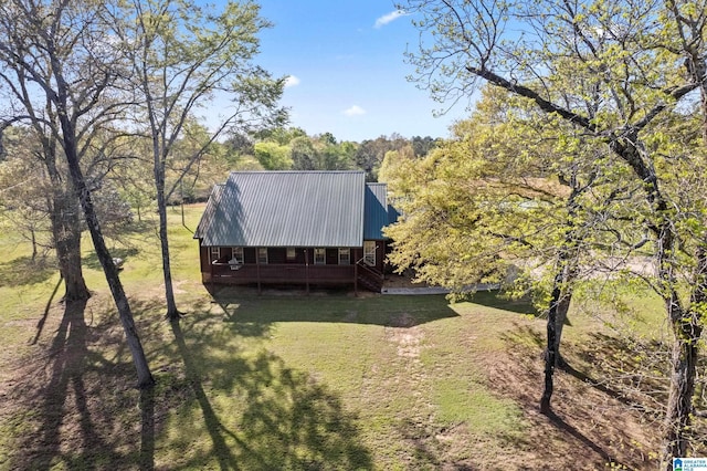 drone / aerial view featuring a forest view