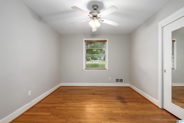 2005 Southwood Rd, Vestavia Hills, AL 35216 - unfurnished room with light wood-type flooring, visible vents, a ceiling fan, and baseboards
