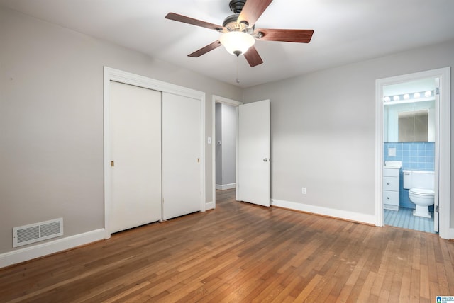 2005 Southwood Rd, Vestavia Hills, AL 35216 - unfurnished bedroom with a closet, visible vents, baseboards, and light wood-style floors