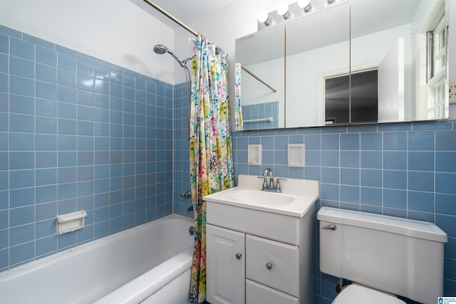 2005 Southwood Rd, Vestavia Hills, AL 35216 - bathroom featuring tile walls, vanity, shower / bath combo with shower curtain, tasteful backsplash, and toilet