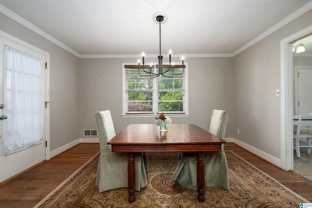 2005 Southwood Rd, Vestavia Hills, AL 35216 - dining area featuring crown molding, a chandelier, wood finished floors, and baseboards
