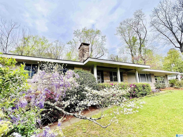 2725 Shades Crest Rd, Vestavia Hills, AL 35216 - exterior space with a yard and a chimney