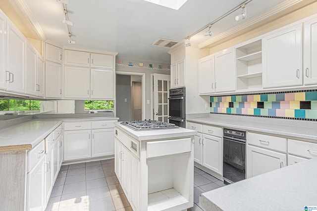 2725 Shades Crest Rd, Vestavia Hills, AL 35216 - kitchen featuring rail lighting, open shelves, light countertops, and dobule oven black