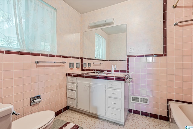 2725 Shades Crest Rd, Vestavia Hills, AL 35216 - bathroom featuring tile walls, toilet, visible vents, and a bath