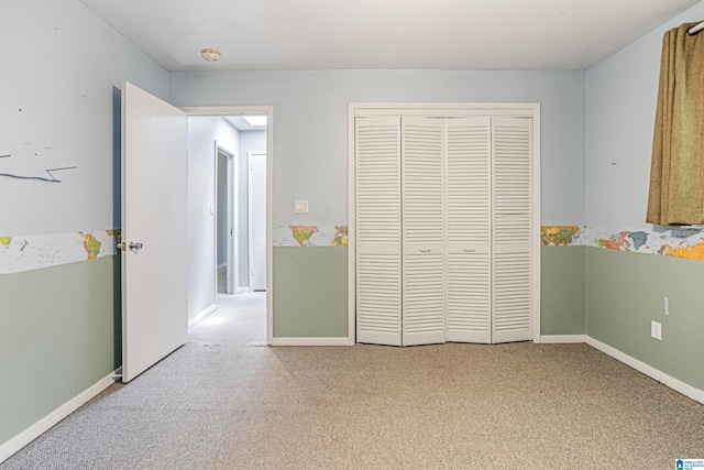 2725 Shades Crest Rd, Vestavia Hills, AL 35216 - unfurnished bedroom featuring baseboards, a closet, and carpet