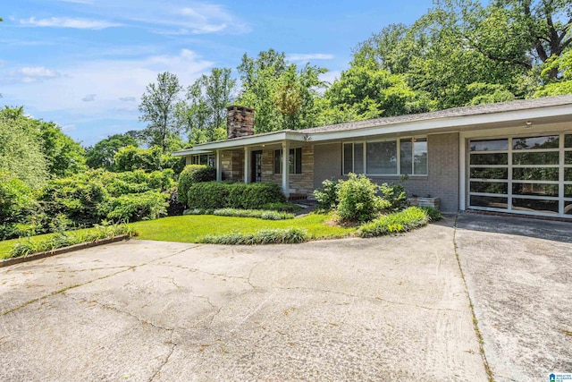 2725 Shades Crest Rd, Vestavia Hills, AL 35216 - view of side of property featuring a chimney and a yard