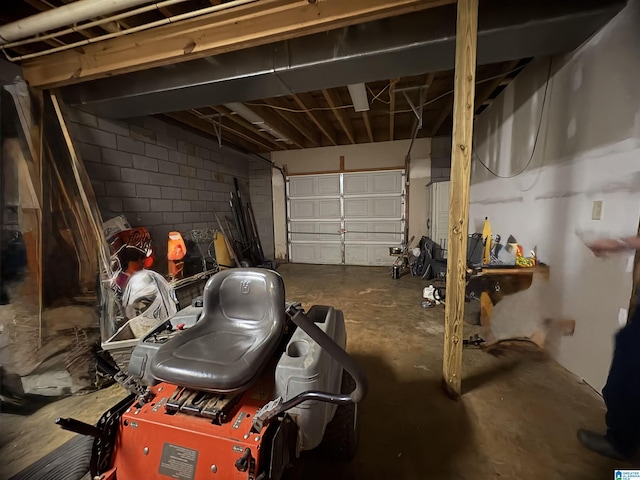 garage featuring concrete block wall