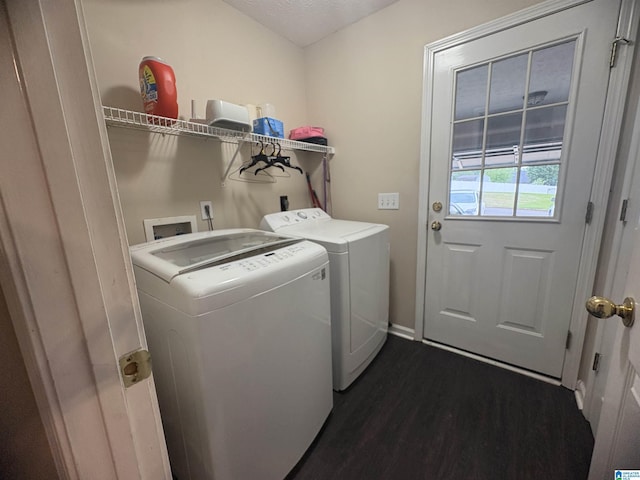 laundry area with baseboards, washer and clothes dryer, laundry area, and dark wood-style flooring