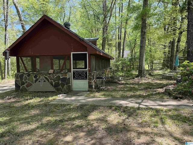 exterior space with stone siding
