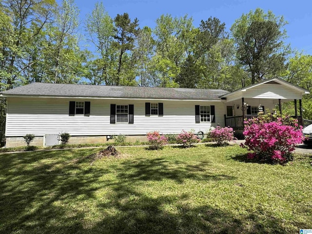 single story home with covered porch and a front yard