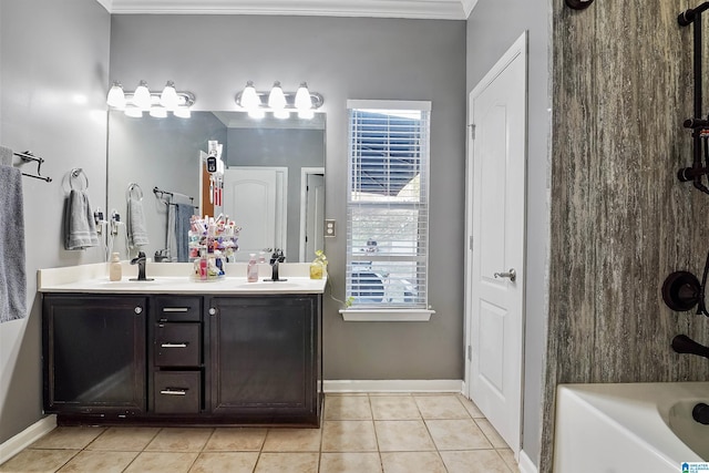 full bath with double vanity, tile patterned flooring, ornamental molding, and a sink