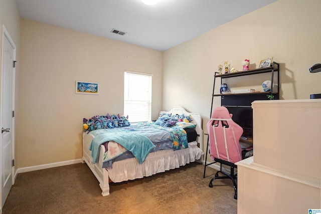 bedroom featuring baseboards, visible vents, and carpet