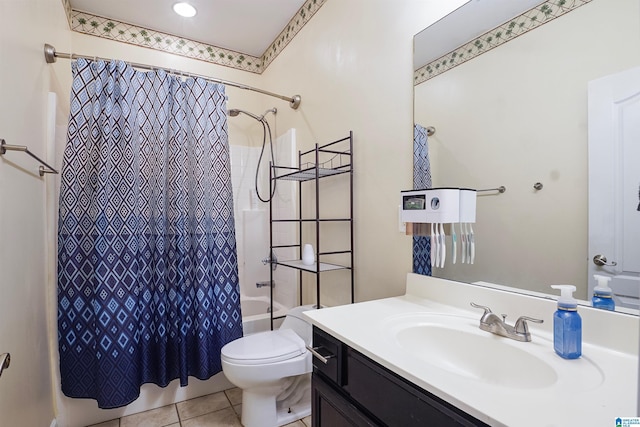 bathroom with shower / tub combo, toilet, vanity, and tile patterned floors