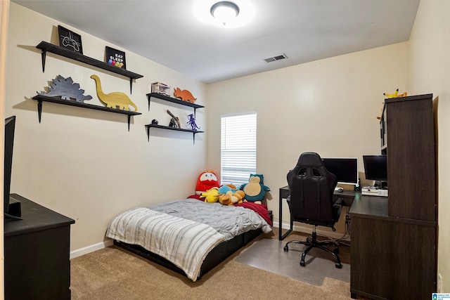 bedroom with visible vents, carpet flooring, and baseboards