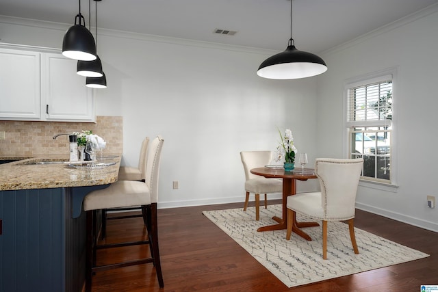 2385 Village Center St, Hoover, AL 35226 - dining room with crown molding, dark wood-style flooring, baseboards, and visible vents