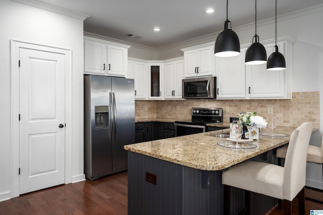 2385 Village Center St, Hoover, AL 35226 - kitchen featuring a peninsula, appliances with stainless steel finishes, visible vents, and white cabinets