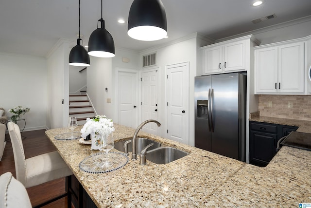 2385 Village Center St, Hoover, AL 35226 - kitchen featuring light stone counters, a sink, visible vents, and stainless steel refrigerator with ice dispenser