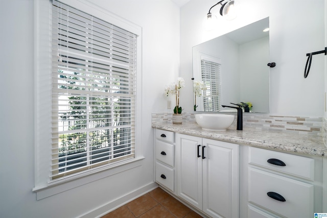 2385 Village Center St, Hoover, AL 35226 - bathroom with vanity, tasteful backsplash, and tile patterned floors
