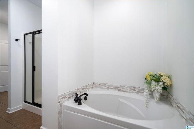 2385 Village Center St, Hoover, AL 35226 - bathroom featuring tile patterned floors, a shower stall, and a bath