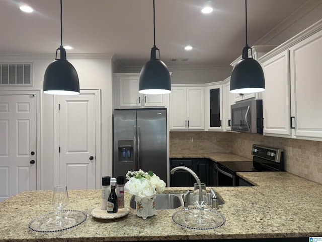 2385 Village Center St, Hoover, AL 35226 - kitchen with appliances with stainless steel finishes, ornamental molding, white cabinets, and visible vents