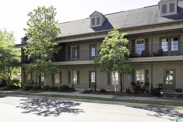 2385 Village Center St, Hoover, AL 35226 - view of front of property with a shingled roof, brick siding, and a balcony