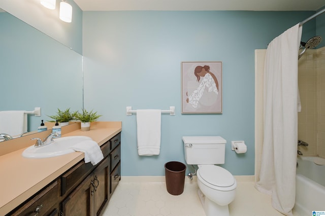 bathroom featuring vanity, shower / bath combination with curtain, baseboards, toilet, and tile patterned flooring
