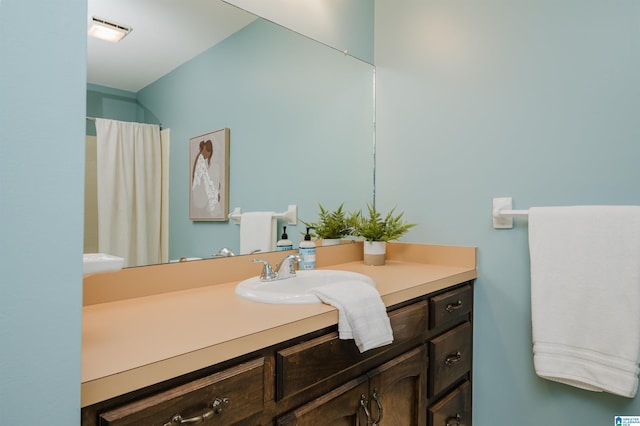 bathroom featuring vanity and a shower with curtain