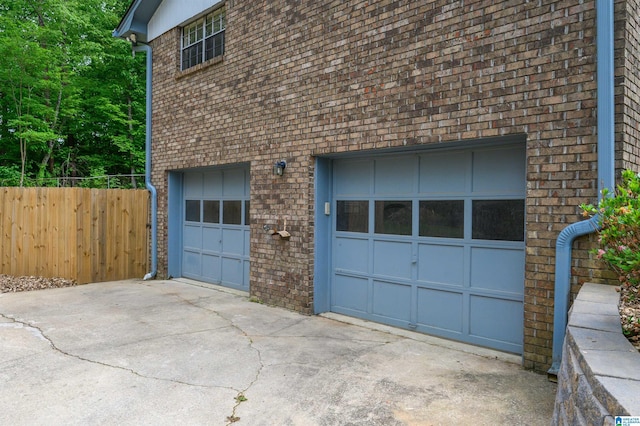 exterior space with driveway and fence