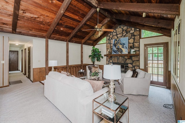 living room featuring carpet floors, vaulted ceiling with beams, and wood ceiling