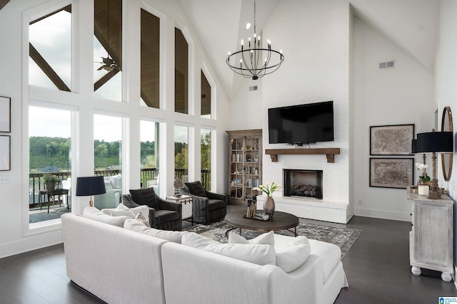 1904 Blackridge Rd, Hoover, AL 35244 - living area featuring visible vents, a fireplace, high vaulted ceiling, baseboards, and dark wood-type flooring